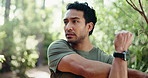 Man, fitness or stretching with arm in forest for workout preparation, exercise or outdoor training. Active, male person or runner getting ready with warm up for physical activity in nature or woods 