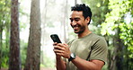 Nature, laugh and man with phone for fitness networking, communication or texting on mobile app. Outdoor, tech and athlete with cellphone for contact with workout, exercise or training in forest.