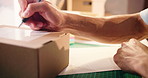 Writing, notes and hands of person for supply chain, shipping and label for delivery with boxes. Small business, ecommerce and worker with paperwork for inventory, distribution and logistics receipt