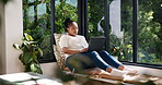 Laptop, relax and black woman in home on sofa for research, website and online shopping on weekend. House, window and person on computer for subscription, internet purchase and rest in living room