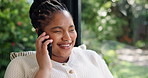 Black woman, phone call and laugh in home, talk and funny conversation for story, gossip or relax in lounge. African person, smartphone and discussion for joke, chat or listen in living room at house