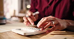 Hands, small business and man with calculator, budget and accounting with revenue. Closeup, person or entrepreneur with financial planning, company audit or profit growth with bills or tax management