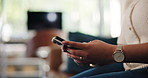 Hands, phone and scroll in lounge at house for contact, chat and check with notification on web. Person, smartphone and click on mobile app, online dating or relax with social network at apartment