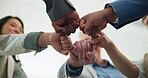 Below, business people and fist bump in office with success for company objective, goal and target. Happy, team huddle and hands together in workplace for unity, group solidarity and collaboration.