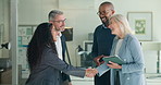 Corporate, people and interview with handshake in office for welcome, introduction and recruitment. Employees, meeting and shaking hands for agreement, thank you and congratulations of b2b onboarding
