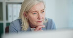 Office, online and woman with computer, thinking or economist with research on website and corporate. Reading, employee or mature person with tech for inflation rates, reflection and financial growth