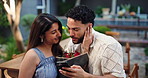 Hug, phone and roses with couple in garden of home together for romance or valentines day. App, dating and flower bouquet with happy people embracing outdoor for bonding, connection or memories