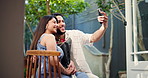 Selfie, laugh and happy couple with flowers at restaurant for love, care and romantic connection. Man, woman and picture on date with bouquet, social media post and funny memory on valentines day