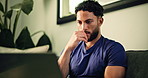 Laptop, planning and typing with man on sofa in living room of home for remote work solution. Computer, reading and thinking with freelance employee in apartment for report, research or review