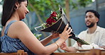 Roses, gift and date with couple in restaurant for valentines day, surprise and romance. Anniversary celebration, flower bouquet and love with man and woman for support, care and marriage present