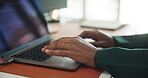 Hands, laptop and typing with business person at desk in office for planning, report or research. Computer, keyboard and productivity with employee closeup in workplace for development or feedback