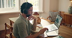 Businessman, reading and laptop with headphones at house for data analysis, finance report or audio. Person, remote work and notes with graphs on pc, financial podcast and stats for profit increase