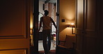 Home, man and walking to bathroom for morning routine, start day or stretching for preparation. Back, open door or person with mirror in bedroom for grooming, getting ready or self care after wake up