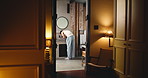 Back, bathroom and man opening doors in hotel room for morning routine, hospitality or wake up. Cleaning, hygiene and washing face with guest at basin for accommodation, skincare or wellness