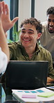 Laptop, man and team with high five at agency for campaign success, positive feedback and graphs. Digital marketing, manager and tech with clapping for ROI performance, market growth and celebration