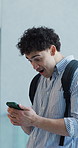Education, surprise or university student with phone in hallway, results release or scholarship success.Achievement, winning or happy man with celebration for online announcement, mobile or excited