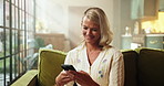 Woman, phone and texting on sofa, relax and happy with notification for web chat in living room. Person, smile and online dating with smartphone, mobile app or social network on couch at apartment