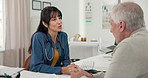 Consultation, doctor and old man in office, healthcare and conversation with feedback for treatment. Pensioner, patient or woman with medical service, support or appointment with discussion or advice