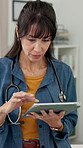 Scroll, doctor and woman on tablet in office for online research, medical service and telehealth. Healthcare, clinic and mature person on digital tech for report, diagnosis and website for medicare