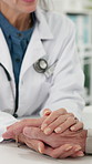 Doctor, senior patient and holding hands with empathy for test results, cancer diagnosis or feedback. Health, old person or professional with support in clinic for bad news, medical crisis or illness