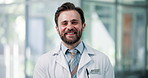 Happy, man and face of doctor in hospital with confidence for healthcare career with support. Professional, smile and portrait of male surgeon with pride for medical help in clinic in Germany.