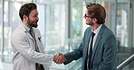 Healthcare, handshake and men in hospital, agreement and onboarding with welcome, greeting and hello. People, medical service and doctors in clinic, shaking hands and thank you with introduction