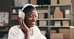 Black woman, logistics and happy with headphones with dance, rhythm and positive work environment. Entrepreneur, music and movement in small business with distribution, streaming audio and playlist