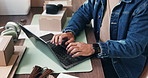 Supply chain, typing and hands of man on laptop in office for online orders, distribution and delivery. Small business, ecommerce and person on computer for logistics, shipping and inventory list