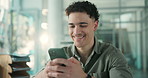 Laugh, flare and man in office with phone, funny text message or good news on email app. Happiness, bokeh and corporate employee in agency with tech, meme or internet comedy on social media.