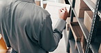 Boxes, clipboard and hands of person in warehouse for shipping schedule or stock management. Above, checklist and inventory with man writing in storage depot for logistics or supply chain delivery