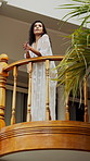 Happy, thinking and woman on summer holiday, balcony and relax on getaway, stress free and low angle. Sightseeing, tourist and person on vacation, confident and break on trip, peaceful or villa