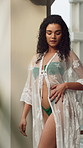 Fashion, bikini and woman in hotel for holiday, luxury vacation and weekend getaway in summer. Hospitality, villa and person pose in swimwear, stylish robe and trendy outfit at resort for travel