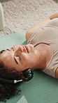 Music, break and woman with headphones on floor, mindfulness or listening to audio in home and rest. Calm, person and tech for sound, relax and zen with playlist on mat, awareness and song on radio