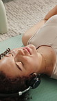 Home, mindfulness and woman with headphones on break, streaming and listening to audio and wellness. Calm, person and tech for sound, relax and zen with playlist on mat, awareness or song on radio