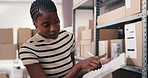 Logistics, boxes or woman with inventory on clipboard for stock control, quality assurance or shipping. Supply chain, black person and writing on checklist in storage for package update, WMS or flare