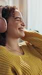 Dance, headphones and laughing with woman in home living room for audio streaming on phone. Break, funny and music with happy person listening to playlist, song or sound in apartment for me time