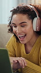 Headphones, laptop and video call with woman on sofa in living room of home for greeting or hello. Computer, smile and wave with excited person in apartment for communication or virtual conversation