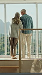 Window, home and back of senior couple together for care, bonding and trust for commitment. Retirement, marriage and elderly man and woman with embrace with reflection, nostalgia and relationship
