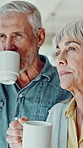 Thinking, coffee and senior couple in kitchen in home for memory, bonding or connection together. Idea, love and elderly man with woman for drinking warm beverage in morning with support in house.