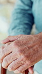 Walking stick, closeup and hands of senior man for reflection, nostalgia and memory outdoor. Retirement, nursing home and elderly person with disability and cane for remember, lonely and wellness