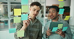 Businessmen, schedule planning or team brainstorming with tablet, tasks or project agenda in office. Male people, colleagues or employees with technology or sticky note for ideas on glass board