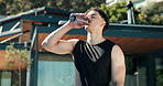 Drinking water, relax and fitness with man outdoor for calm, hydration or training recovery. Electrolyte drink, break and wellness with person at house for sports athlete, exercise and mineral liquid
