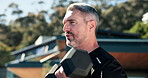 Training, outdoor and man with dumbbells, fitness and bodybuilding for muscle development and health. Bodybuilder, active and mature person with weights for exercise at home and metabolism boost