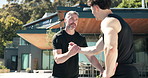 Exercise, personal trainer and men outdoor with handshake for fitness, training and workout goals. House, team and mature man with coach and support, done and happy for wellness, health and progress