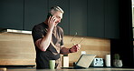 Phone call, laptop and freelancer with man in kitchen for networking, project consultant and talking. Virtual advisor, discussion and planning with mature person in home for remote worker and chat