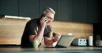 Phone call, laptop and talking with man in kitchen for networking, project consultant and freelancer. Virtual advisor, discussion and planning with mature person in home for remote worker and chat