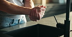 Washing, soap and hands of person in kitchen for cleaning, hygiene and disinfection for germs. Home, faucet and man by sink for dirt removal, protection or bacteria prevention for health and wellness