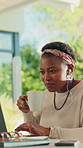 Patio, earphones and woman with laptop, coffee and freelancer with design project on web and typing. Remote work, graphic designer and black person with tech for music, bokeh and hot tea at home