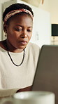 Remote work, laptop and black woman in home for online article, proofreading and editing report. Freelancer, house and person on computer for research, copywriting and planning for news review