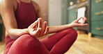 Woman, hands and yoga in home with lotus pose for meditation, spiritual awareness and chakra healing. Zen, person and mindfulness exercise in house for inner peace, holistic health or soul cleansing.